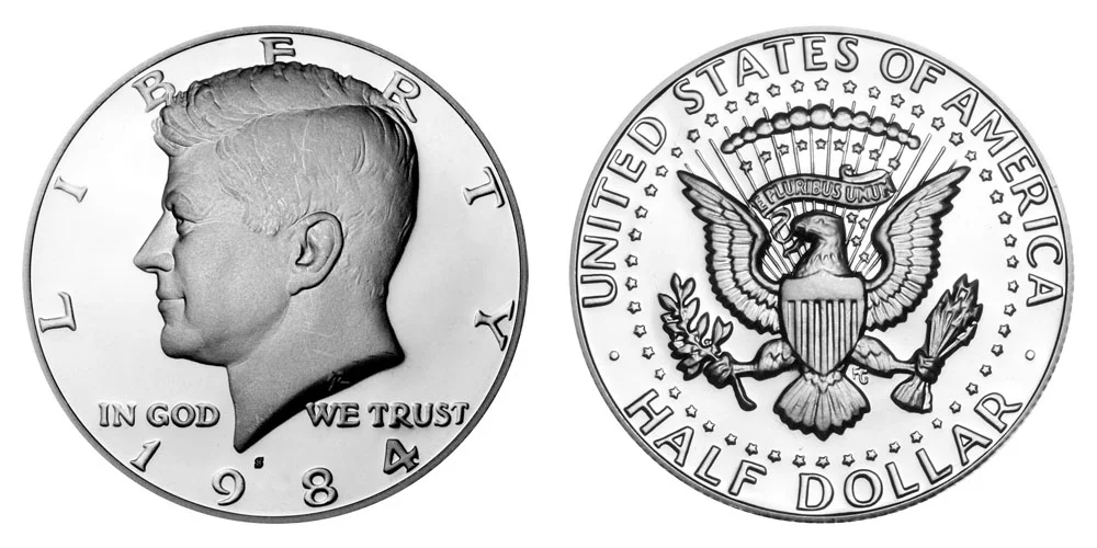 1984-S Kennedy half dollar double-struck proof error showing second off-center strike on obverse