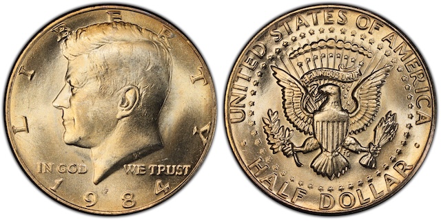 1984 Kennedy half dollar grading strip showing four condition tiers from worn circulated to gem uncirculated